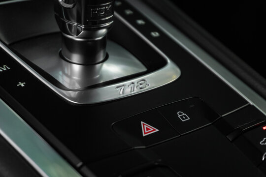 Porsche 718 Cayman PDK shifter and model designation, Luxury sports car interior center console detail
