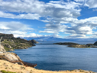 Fototapeta premium Landscape view from the town of Chile Chico overlooking the turquoise waters of Lake General Carrera in Patagonia, Chile. The vast lake stretches toward the distant peaks of the Patagonian Andes.