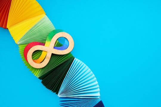 Rainbow infinity symbol on colorful spectrum fans