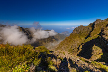 Majestic mountain range landscape bathed in sunlight, Pico do Arieiro, Madeira, background or wallpaper	