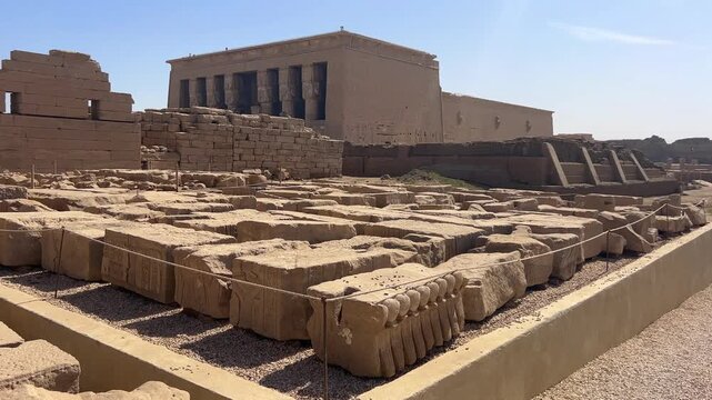 Exterior view of the monumental Temple of Hathor at Dendera, Egypt, featuring grand stone facade and finely carved reliefs.