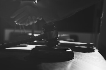 Obraz premium Consultation and conference of professional businesswoman and Male lawyers working and discussion having at law firm in office. Concepts of law, Judge gavel with scales of justice