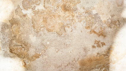 Close-up of a heavily textured and crumbling old plaster or concrete wall surface. The rough, damaged facade shows signs of decay and age, ideal for a grunge background or industrial design element. © Aliaksei