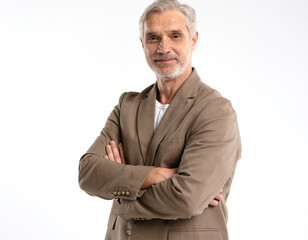 Serious middle-aged man posing in front of a grey background with copy space.