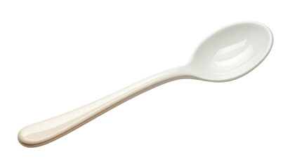 Sleek ivory spoon, glossy, diagonally positioned against a dark background