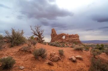 Dramatic landscape of Arches National Park Utah USA, turret arch on a moody cloudy day. nature and travel banner. place for text © piksik