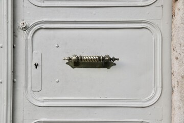 Decorative Door Handle and Lock Detail on Metal Door