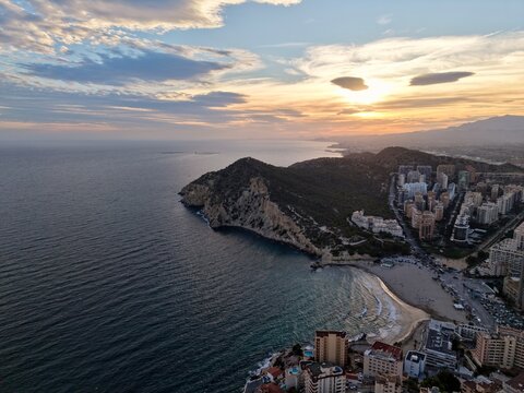 beautiful sunset over landscape, spectacular twilight panorama showcasing glowing hills and distant lights