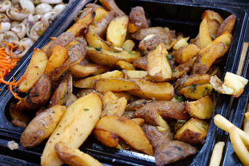 Fried yellow potatoes. Various foods in street fast food restaurant