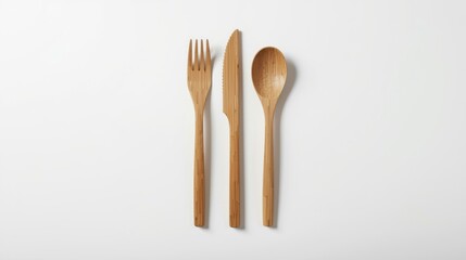 Bamboo cutlery set with fork knife and spoon on white background eco friendly utensils for sustainable living