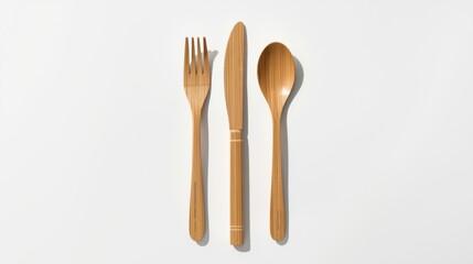 Bamboo cutlery set consisting of a fork knife and spoon on white background eco friendly utensils for sustainable living