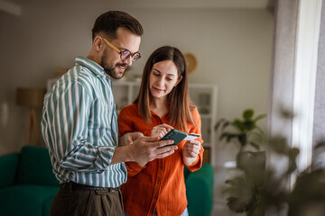 Couple doing online shopping, paying with credit card