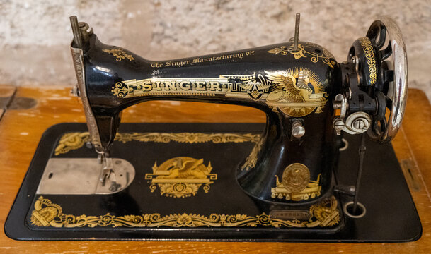 Olivenza, Spain - 14 Oct 23: Antique Singer Sewing Machine with Gold Decals