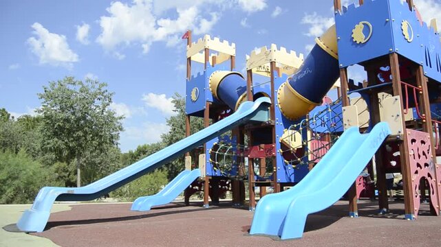 Children Playing in Outdoor Playground on Sunny Day