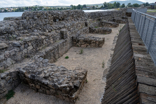 Excavated stone structures beside walkway at Proserpina Reservoir