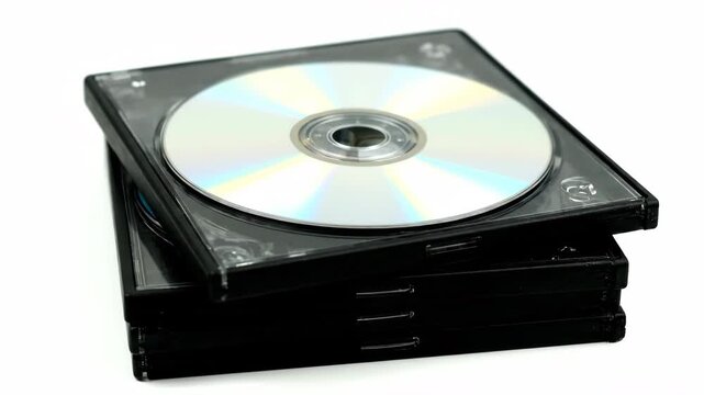 A stack of black DVD cases with a single silver disc on top, isolated against a clean white background. Represents digital media storage.