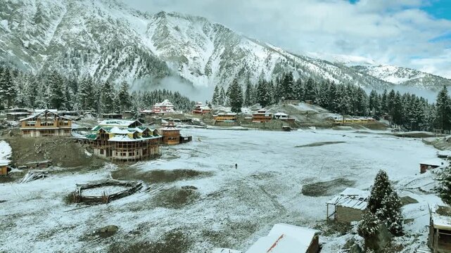 Aerial drone sunrise view of Fairy Meadows National Park with morning fog, Rakhiot Glacier and Nanga Parbat peak in Karakoram Range, Northern Pakistan .