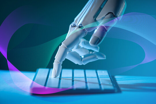 Artificial neural network. Robot using computer keyboard at table