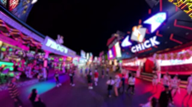 PATTAYA, THAILAND - DEC 2025 : Blurred view of Walking Street in Pattaya city at night. Famous street for nightlife (club, bar and go go bar).