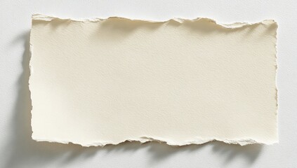 Obraz premium A torn paper edge on a white surface, casting soft shadows