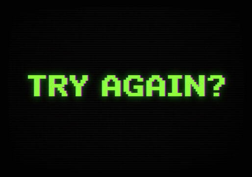Retro video game screen with green pixelated Try Again text on black background