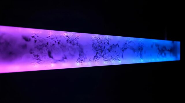 Glowing rectangular prism with purple and blue gradient lighting effects inside