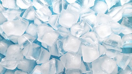 Top view of fresh ice cubes on blue background. Crystal clear ice cube texture with cold feeling. Crushed ice pieces creating a cool frozen background. © Firman