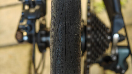 Close-up of Worn and Cracked Bicycle Tire Tread with Blurred Cassette Background