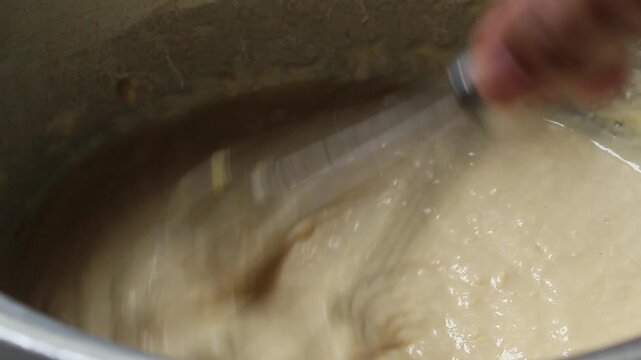 stirring the batter using a whisk