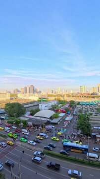 BANGKOK, THAILAND - NOV 2025 : Aerial high angle view of Chatuchak Weekend Market. Largest market in Thailand. Travel and tourism concept video. Time lapse shot, sunset to night.