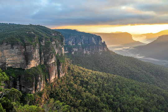 Govetts Leap Lookout in the Blue Mountains, New South Wales, Australia. Early morning light illuminates towering sandstone cliffs and the expansive Grose Valley