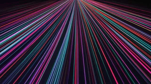 A perspective of vibrant colored light rays shooting outwards from a point into a dark backdrop, creating a sense of movement. The rays form a beautiful pattern