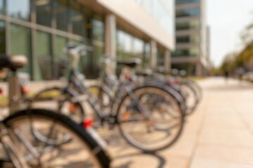 Obraz premium Blurry many bicycles on a covered bicycle parking lot next to a car park in the city center 