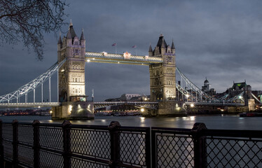 Tower bridge spanning river thames at night in london