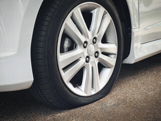 Flat car tire, punctured rubber wheel accident and breakdown concept