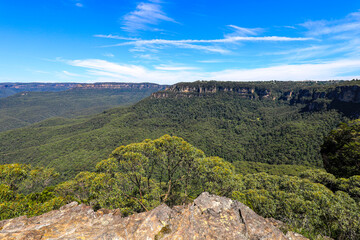 Scenic landscape view of Jamison Valley captured from Sublime Point lookout in the Blue Mountains showing forested valley, cliffs, and expansive wilderness terrain.