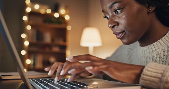 Woman working on laptop computer.