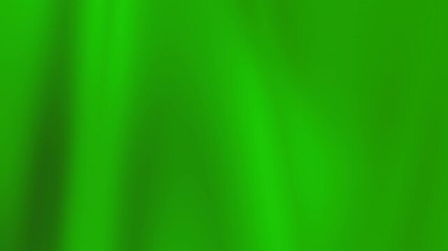A vibrant green fabric texture viewed from a close-up perspective showcasing the intricate weave and folds in a studio setting