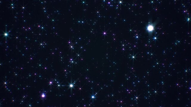 Particles colorful video contains a collection of spectacular twinkling colorful particles moving about a dark space in different directions.