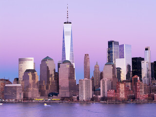 Obraz premium New York City panorama at sunrise. Manhattan skyline at dusk. New York City skyscrapers panorama at sunset. Manhattan panoramic skyline at dusk. New York City skyline background at sunrise.