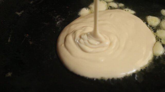 close up of cooking pancakes in a pan