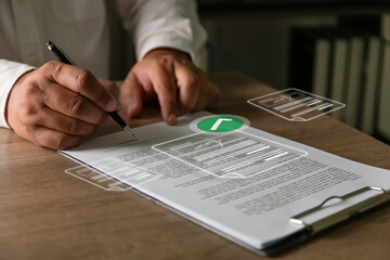 Business professional signing contract document with digital approval and verification concept on office desk representing online legal agreement process.