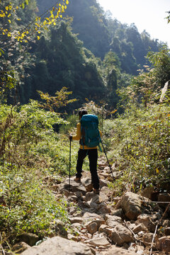 Woman backpacker hking in the mountains