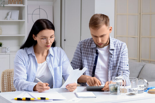Young couple planning budget at home