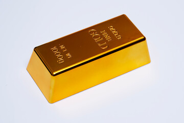 Gold bar in golden luxury. Gold bar metal on isolated studio background. Gold bar in bullion.