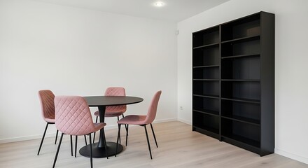 Fototapeta premium Black dining table with pink chairs and empty bookshelf against white wall black table wooden floor