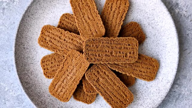 Caramel biscuit cookies, or shortbread, are a healthy breakfast staple. Biscuit cookies as a food background for your design