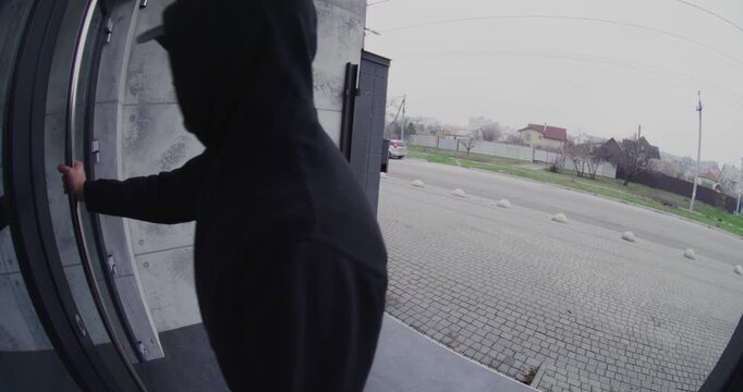 Smart Doorbell Video Shows Aggressive Adult Man Forcing Entry Through Front Door and Attacking Homeowner, Punching and Kicking After Breach. Concept of Home Invasion, Violence, Home Security.