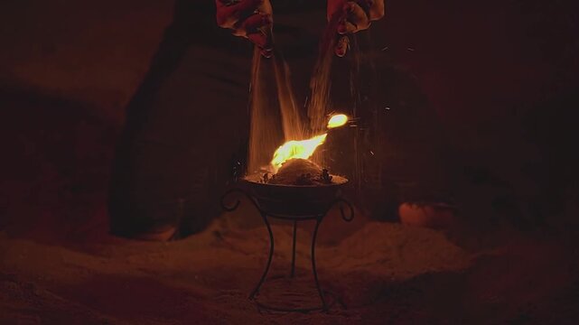 Woman. Female hands. Fire show. Sand. Bowl of fire. Slow motion video. High quality 4k footage