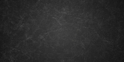 Dark charcoal grunge wall texture background. Dark black rough grunge surface with smoke edge. Black texture chalk board and black board. © MDFAIMIDULISLAM